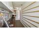 Hallway view into office with an abundance of natural light and ample storage space at 3759 Collingwood Ln, Oviedo, FL 32765