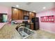 Bright kitchen featuring modern appliances, ample counter space, and a charming display shelf, creating a warm atmosphere at 3759 Collingwood Ln, Oviedo, FL 32765