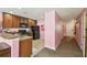 Spacious kitchen seamlessly connecting to hallway, offering modern appliances and generous counter space for cooking at 3759 Collingwood Ln, Oviedo, FL 32765