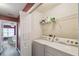 Functional laundry room featuring a washer, dryer, and shelving for storage at 3759 Collingwood Ln, Oviedo, FL 32765