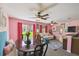 Open-concept living room and dining area with stylish decor and ample natural light at 3759 Collingwood Ln, Oviedo, FL 32765
