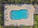 Aerial view of a community pool with lounge chairs and surrounding trees at 3759 Collingwood Ln, Oviedo, FL 32765