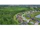 Aerial view showcasing the home's location with a lovely lake and lush green surroundings at 3824 Gulf Shore Cir, Kissimmee, FL 34746