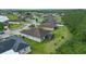 An aerial view highlights the home's screened patio and expansive backyard space at 3824 Gulf Shore Cir, Kissimmee, FL 34746