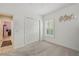 The bedroom features a closet, window with plantation shutters, and door to the kitchen at 3824 Gulf Shore Cir, Kissimmee, FL 34746