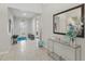 Bright foyer with tile flooring, console table with mirror, and natural light at 3824 Gulf Shore Cir, Kissimmee, FL 34746