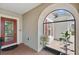 Inviting front porch with decorative glass door and brick pavers at 3824 Gulf Shore Cir, Kissimmee, FL 34746