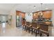 Stylish kitchen with a center island with seating and stainless steel appliances at 3824 Gulf Shore Cir, Kissimmee, FL 34746