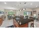 Kitchen island with granite countertop and stainless steel sink overlooks breakfast nook and living area at 3824 Gulf Shore Cir, Kissimmee, FL 34746