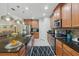 Spacious kitchen with stainless appliances, granite countertops and modern pendant lighting at 3824 Gulf Shore Cir, Kissimmee, FL 34746