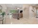 Spacious living room featuring a large sectional sofa, tile floors, and natural light at 3824 Gulf Shore Cir, Kissimmee, FL 34746