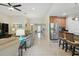 Open-concept living space with tile flooring, a spacious living room and an eat-in kitchen at 3824 Gulf Shore Cir, Kissimmee, FL 34746