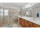 This bathroom includes a tile shower with glass door and a vanity with generous counter space at 3824 Gulf Shore Cir, Kissimmee, FL 34746