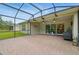 An outdoor patio with brick floors features a sliding glass door entrance to the home at 3824 Gulf Shore Cir, Kissimmee, FL 34746