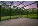 Screened in patio with brick flooring offers peaceful views of the surrounding nature at 3824 Gulf Shore Cir, Kissimmee, FL 34746