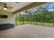 Spacious screened patio boasts brick flooring and a ceiling fan for year-round enjoyment at 3824 Gulf Shore Cir, Kissimmee, FL 34746