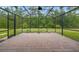 A screened in brick patio offers scenic views and a peaceful space to relax outdoors at 3824 Gulf Shore Cir, Kissimmee, FL 34746