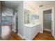 Bright bathroom featuring a vanity with cabinet space and a walk-in shower offers practicality and style at 4113 Stonefield Dr, Orlando, FL 32826