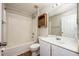 Full bathroom with a shower and tub combo plus built-in storage and a vanity provides convenience and practicality at 4113 Stonefield Dr, Orlando, FL 32826