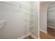 Walk-in closet with sturdy shelving along the wall provides ample and organized storage space at 4113 Stonefield Dr, Orlando, FL 32826