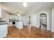 Open-concept kitchen with laminate flooring and arched entryway at 4113 Stonefield Dr, Orlando, FL 32826