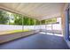 Large, screened patio offering an outdoor living area with views of the fenced backyard and mature trees at 4113 Stonefield Dr, Orlando, FL 32826