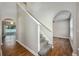 Inviting staircase with arched entryway and modern design at 4113 Stonefield Dr, Orlando, FL 32826