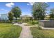 The backyard has a fire pit, landscaped walkways, and a hot tub at 4153 Cortland Dr, Davenport, FL 33837