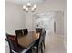The dining room features an archway to the kitchen and a dark wood table with seating for six at 4153 Cortland Dr, Davenport, FL 33837