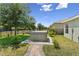 Landscaped backyard features a fenced-in yard with a hot tub at 4153 Cortland Dr, Davenport, FL 33837