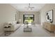Cozy living room with stylish furniture, neutral tones, and slider to the outside at 4153 Cortland Dr, Davenport, FL 33837