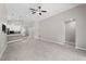 Spacious living room featuring an open layout with easy access to the kitchen and other rooms at 4153 Cortland Dr, Davenport, FL 33837