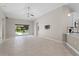 Expansive living room with high ceilings and slider to the outdoor space at 4153 Cortland Dr, Davenport, FL 33837