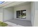 Covered patio with sliding glass doors offers seamless indoor-outdoor living at 4153 Cortland Dr, Davenport, FL 33837