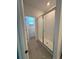 Bright bathroom featuring a glass enclosed shower, white subway tile surround, and wood look flooring at 4716 Homestead Trl, St Cloud, FL 34772
