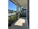View of the cozy front porch showing decorative columns and black metal railing at 4716 Homestead Trl, St Cloud, FL 34772