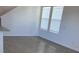 Bright living room with wood-look tile flooring and large windows at 4716 Homestead Trl, St Cloud, FL 34772