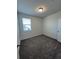 A bright bedroom with carpet and window, ready for personalization at 4720 Homestead Trl, St Cloud, FL 34772