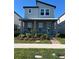 Charming two-story home with a cozy front porch and well-maintained landscaping at 4720 Homestead Trl, St Cloud, FL 34772
