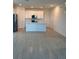Modern kitchen with white cabinetry, stainless steel appliances, and light tile flooring at 4720 Homestead Trl, St Cloud, FL 34772