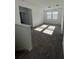 Upstairs loft area with carpeting and natural light from the windows at 4720 Homestead Trl, St Cloud, FL 34772
