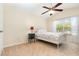 Bedroom with a window for natural light, neutral colored walls, and carpeted floor at 5037 Hawkstone Dr, Sanford, FL 32771