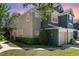 Two-story townhome showcasing manicured lawn, attached garage, and muted color palette at 5037 Hawkstone Dr, Sanford, FL 32771