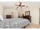 Spacious main bedroom features a ceiling fan, carpeted floors, and neutral walls at 5037 Hawkstone Dr, Sanford, FL 32771