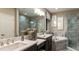 This bathroom features marble countertops, tile flooring, and a soaking tub at 5223 Quillback Ln, St Cloud, FL 34771
