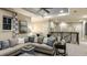 Spacious game room with comfortable seating, a ceiling fan, and staircase overlooking the home at 5223 Quillback Ln, St Cloud, FL 34771