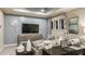 Cozy living room with large TV, modern sofa, and stylish decorative accents at 5223 Quillback Ln, St Cloud, FL 34771