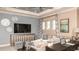 Media room with a large sofa, decorative wall art, and a ceiling fan at 5223 Quillback Ln, St Cloud, FL 34771