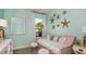 Bright bedroom features starfish decor, daybed, and modern furnishings at 5259 Quillback Ln, St Cloud, FL 34771