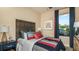 Cozy bedroom with stylish Buccaneers themed decor and a comfortable bed at 5259 Quillback Ln, St Cloud, FL 34771
